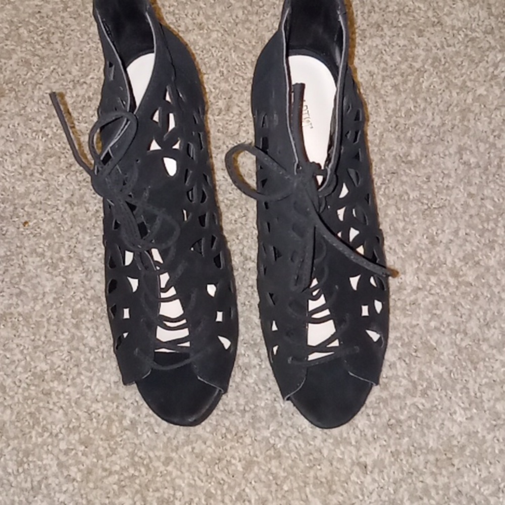 All black with unique cut out, high heels.  The brand are APT.9